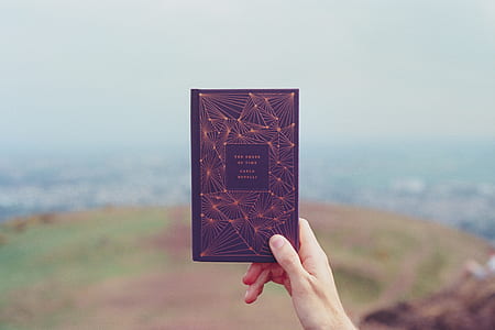 person holding book thumbnail