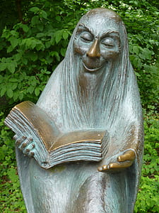 statue of man reading book thumbnail