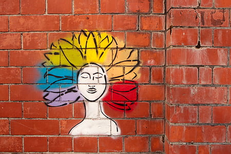 woman's colored haired graffiti painted on wall thumbnail