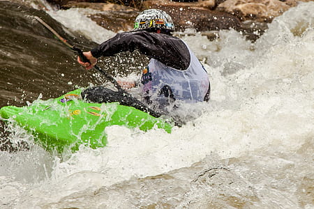 person kayaking on flowing river thumbnail