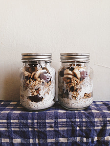 two clear glass jars on table thumbnail
