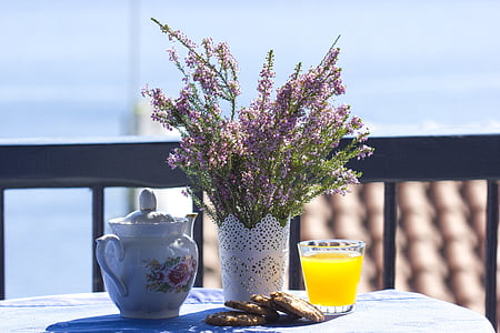 purple lavenders beside glass of juice thumbnail