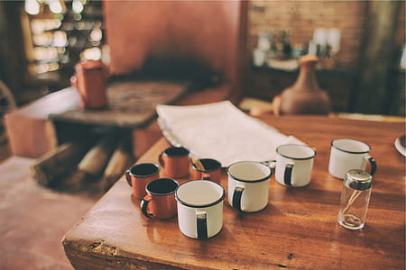 white and brown cups on table thumbnail