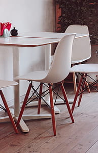 Two White Loo Tables With Four Chairs thumbnail