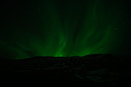 mountain under green sky thumbnail