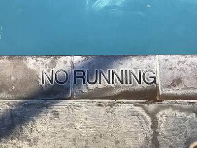 white and grey brick wall with No running carved thumbnail