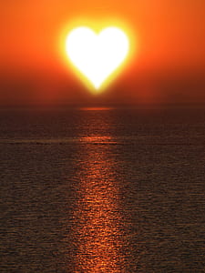 heart-shaped sun over body or water thumbnail