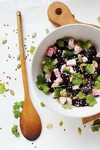 brown wooden kitchen utensil and salad on white bowl thumbnail