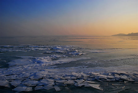 aerial view of body of water during golden hour thumbnail