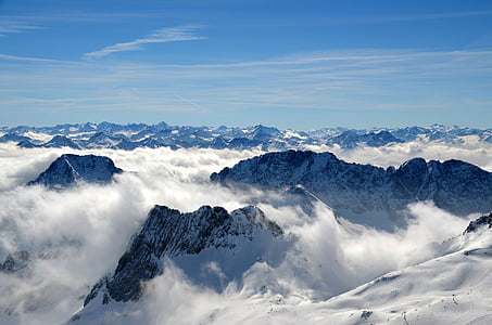 aerial photography of mountain covered with snow under blue sky thumbnail