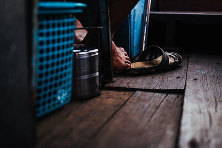 low angle photography of person sitting on chair thumbnail