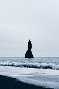 photo of island at sea during daytime thumbnail