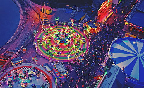 people at amusement park during night time thumbnail