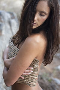 woman covering her breast using gray cloth thumbnail