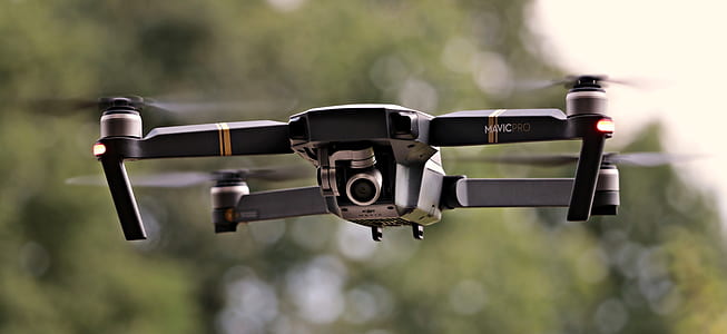 black quadcopter selective focus photography thumbnail