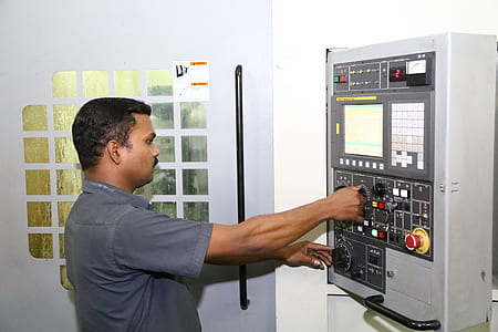 man operating digital machine thumbnail