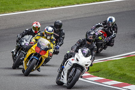 motor racers on asphalt road thumbnail