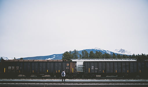 person standing in front of train thumbnail