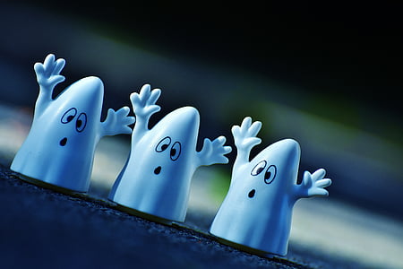 selective focus photography of three white ghost figures thumbnail