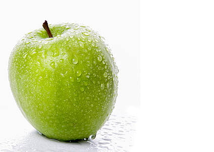 green apple on white surface thumbnail