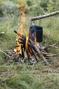 flamed firewood with black metal can thumbnail