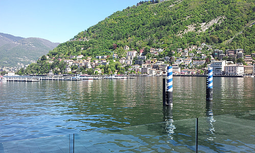glass dock and two posts on water during daytime thumbnail