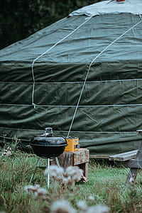 black kettle grill beside green tent thumbnail