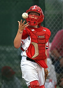 selective focus photo of person holding tossing baseball thumbnail