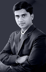 grayscale photography of man wearing suit thumbnail