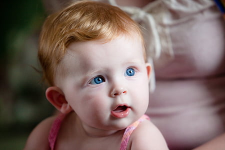 blue-eyed baby wearing pink spaghetti strap top thumbnail