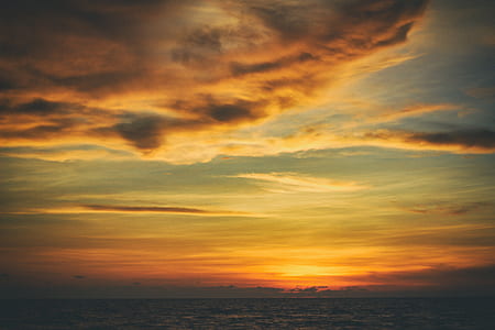 photo of body of water during golden hour thumbnail