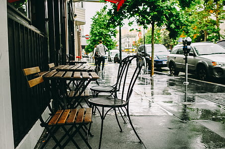 car parked beside sidewalk with table thumbnail