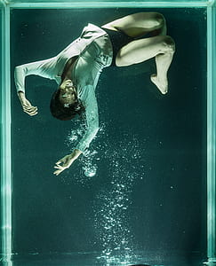 drowning person on clear glass tank thumbnail