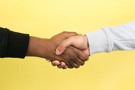 Hand Shake On Yellow Photo thumbnail