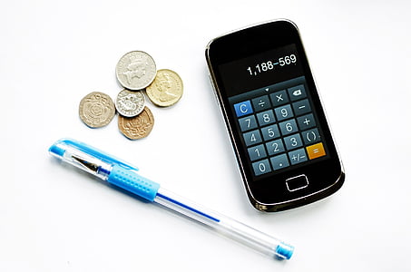 blue pen beside coins and black slide phone thumbnail