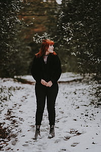 woman standing holding her hand thumbnail