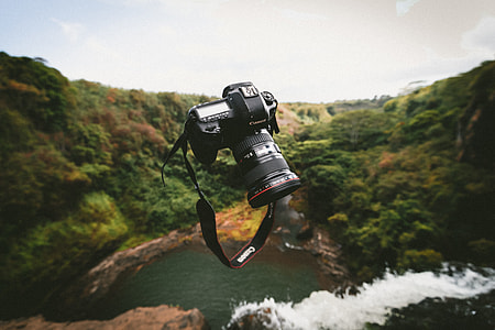 black Canon DSLR camera in selective focus photography thumbnail