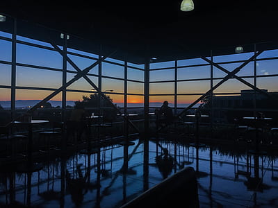 silhouette photography of chairs and tables thumbnail