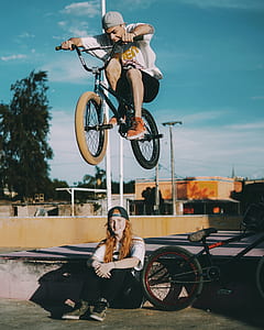 man on black BMX bike thumbnail