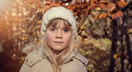 girl standing while smiling thumbnail
