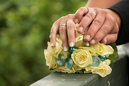 man and woman holding flower bouquet thumbnail