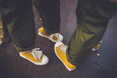 matching pairs of yellow low-top sneakers thumbnail