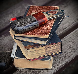 eyeglasses with case on books thumbnail