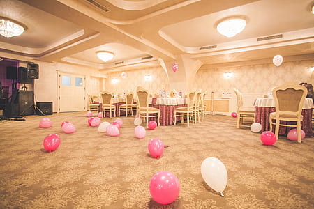 pink and white balloon lot on brown floor thumbnail