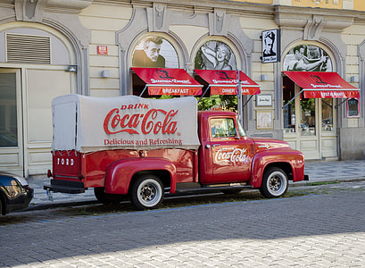 Coca-cola single cab truck in front of building thumbnail