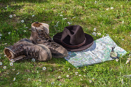 brown fedora hat and brown boots near map thumbnail