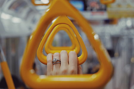 person wearing silver-colored ring with clear gemstone thumbnail