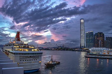 cruise chip on body of water near buildings thumbnail