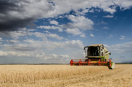 photo of green harvester on grass field thumbnail