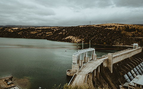 aerial view of dam near bridge during daytime thumbnail